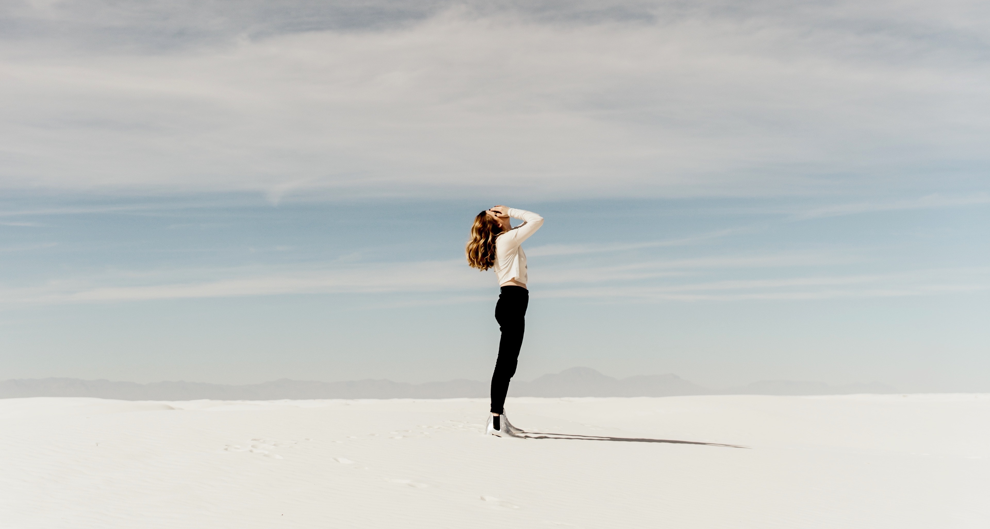 Stock photo of woman standing in a desert
